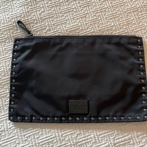 Valentino clutch/ travel necessary.